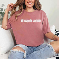 May include a person wearing a mauve colored graphic t-shirt with the Spanish phrase “Mi Terapeuta Se Rindió”.
