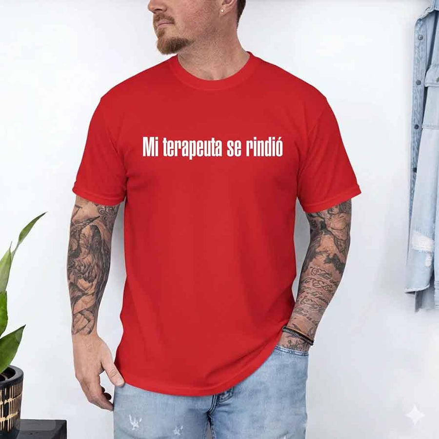 May include a person wearing a red colored graphic t-shirt with the Spanish phrase “Mi Terapeuta Se Rindió”.