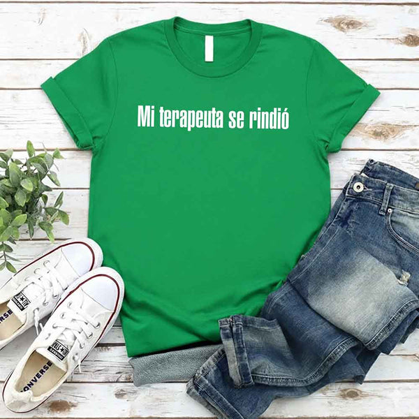 May include a person wearing a green colored graphic t-shirt with the Spanish phrase “Mi Terapeuta Se Rindió”.