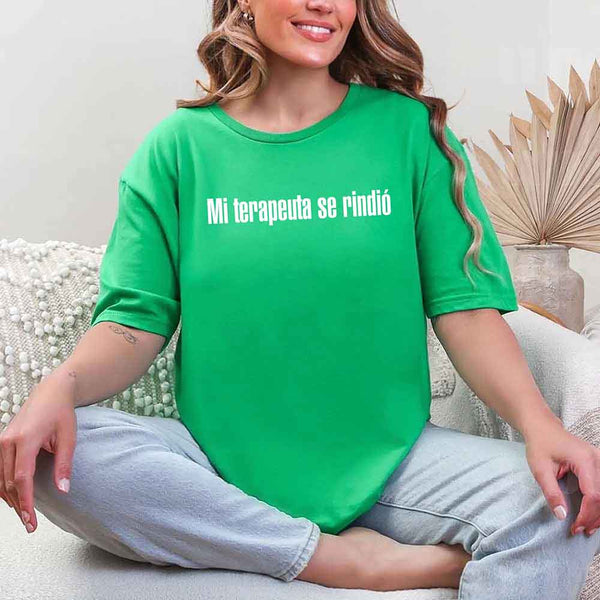 May include a person wearing a green colored graphic t-shirt with the Spanish phrase “Mi Terapeuta Se Rindió”.