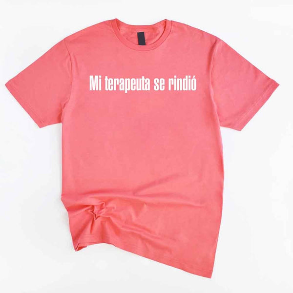 May include a person wearing a coral silk colored graphic t-shirt with the Spanish phrase “Mi Terapeuta Se Rindió”.