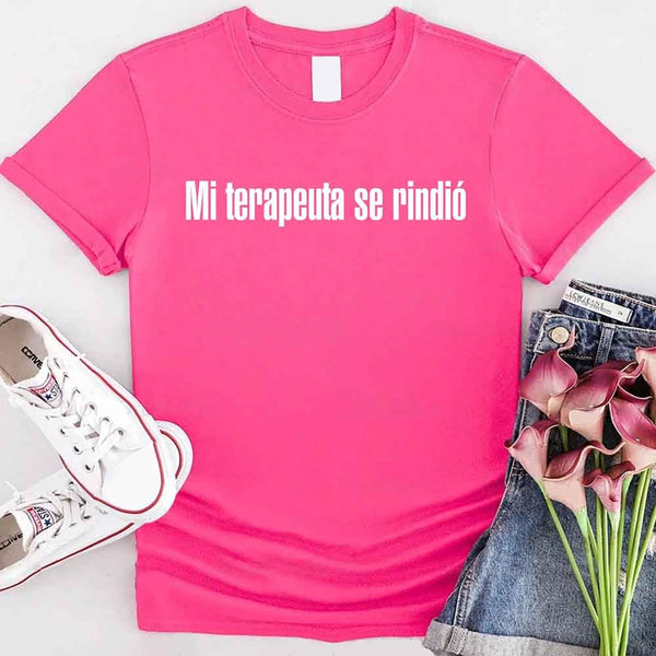 May include a person wearing a heliconia colored graphic t-shirt with the Spanish phrase “Mi Terapeuta Se Rindió”.