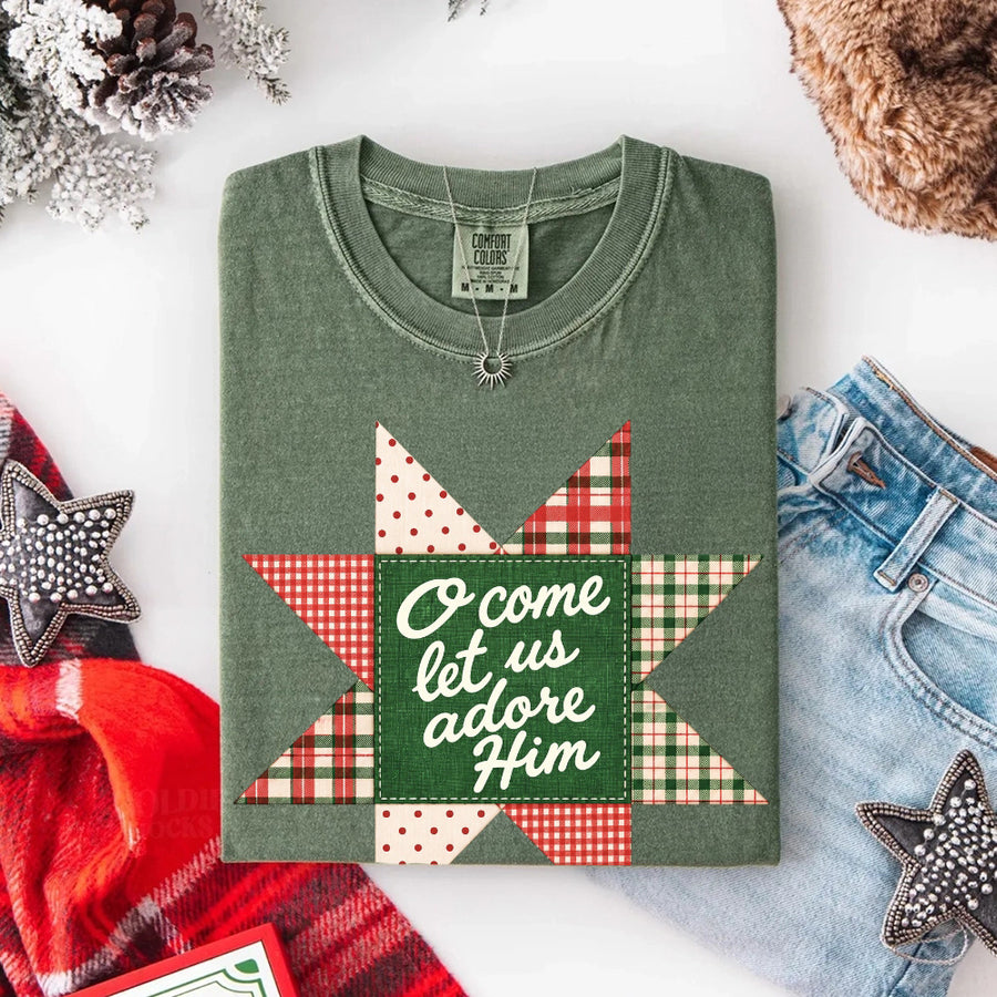May include an O Come Let Us Adore Him Comfort Colors Christmas T-Shirt featuring a Christian holiday message inspired by a beloved Christmas hymn, designed for church services, family gatherings, worship events, and meaningful seasonal gifting.