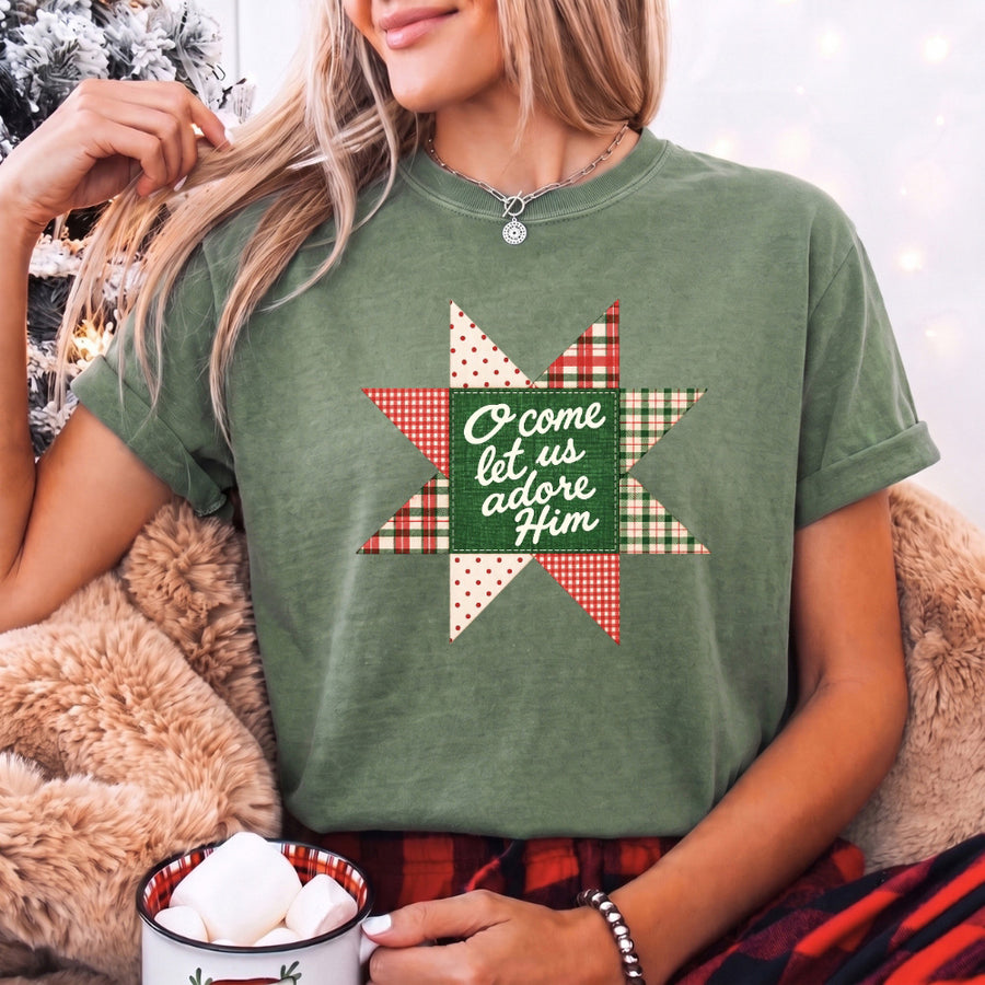 May include an O Come Let Us Adore Him Comfort Colors Christmas T-Shirt featuring a Christian holiday message inspired by a beloved Christmas hymn, designed for church services, family gatherings, worship events, and meaningful seasonal gifting.