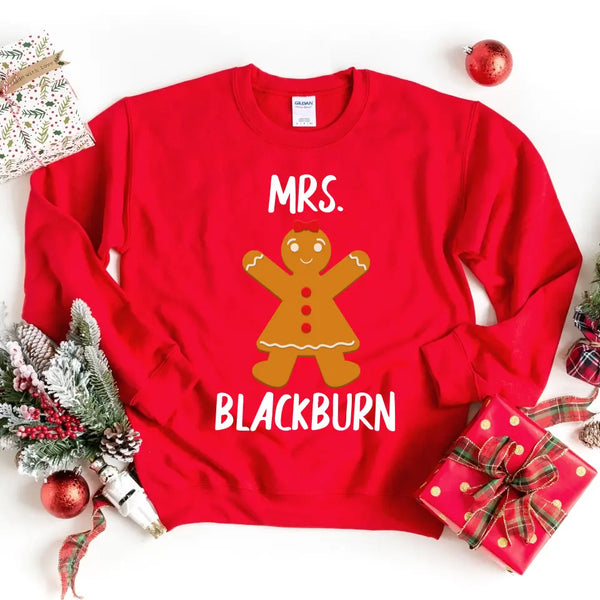 May include a Christmas t-shirt featuring a “Mr & Mrs” holiday design with personalized names printed on front, styled with festive decorations.