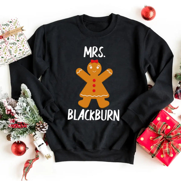 May include a Christmas t-shirt featuring a “Mr & Mrs” holiday design with personalized names printed on front, styled with festive decorations.