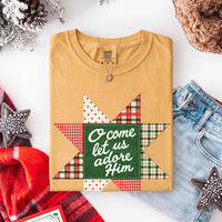 May include an O Come Let Us Adore Him Comfort Colors Christmas T-Shirt featuring a Christian holiday message inspired by a beloved Christmas hymn, designed for church services, family gatherings, worship events, and meaningful seasonal gifting.