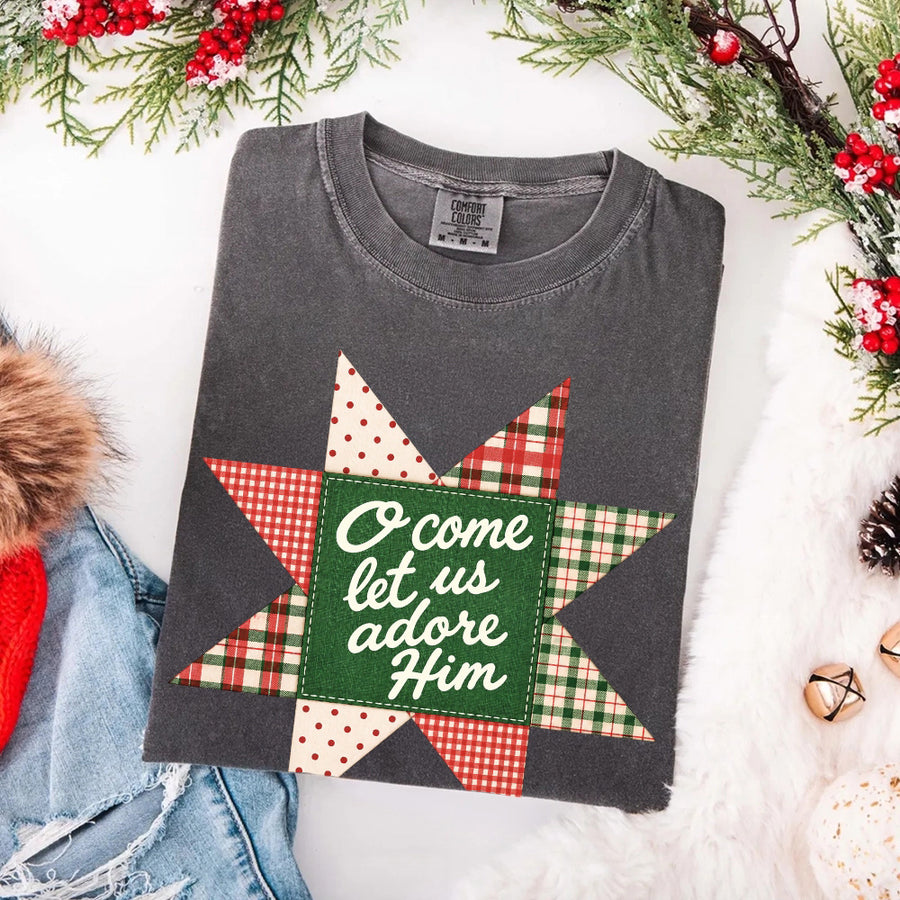 May include an O Come Let Us Adore Him Comfort Colors Christmas T-Shirt featuring a Christian holiday message inspired by a beloved Christmas hymn, designed for church services, family gatherings, worship events, and meaningful seasonal gifting.
