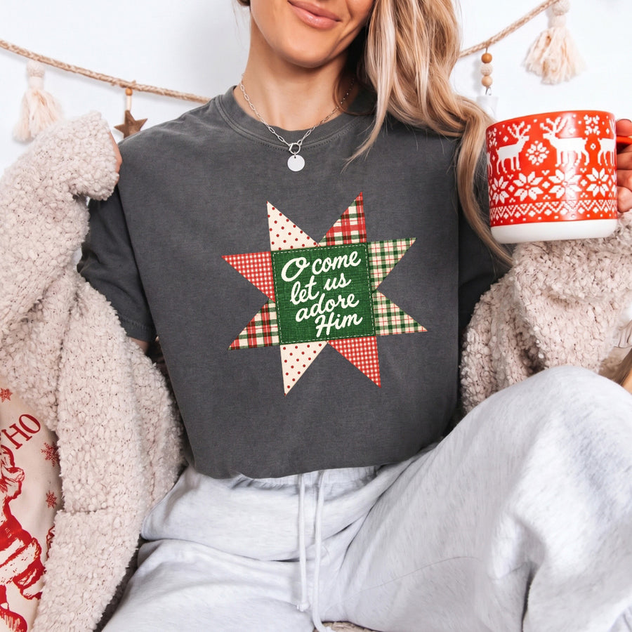 May include an O Come Let Us Adore Him Comfort Colors Christmas T-Shirt featuring a Christian holiday message inspired by a beloved Christmas hymn, designed for church services, family gatherings, worship events, and meaningful seasonal gifting.