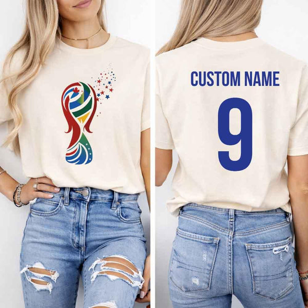 May include a person wearing a cream 2026 World Cup T-shirt featuring bold soccer graphic and relaxed fit.