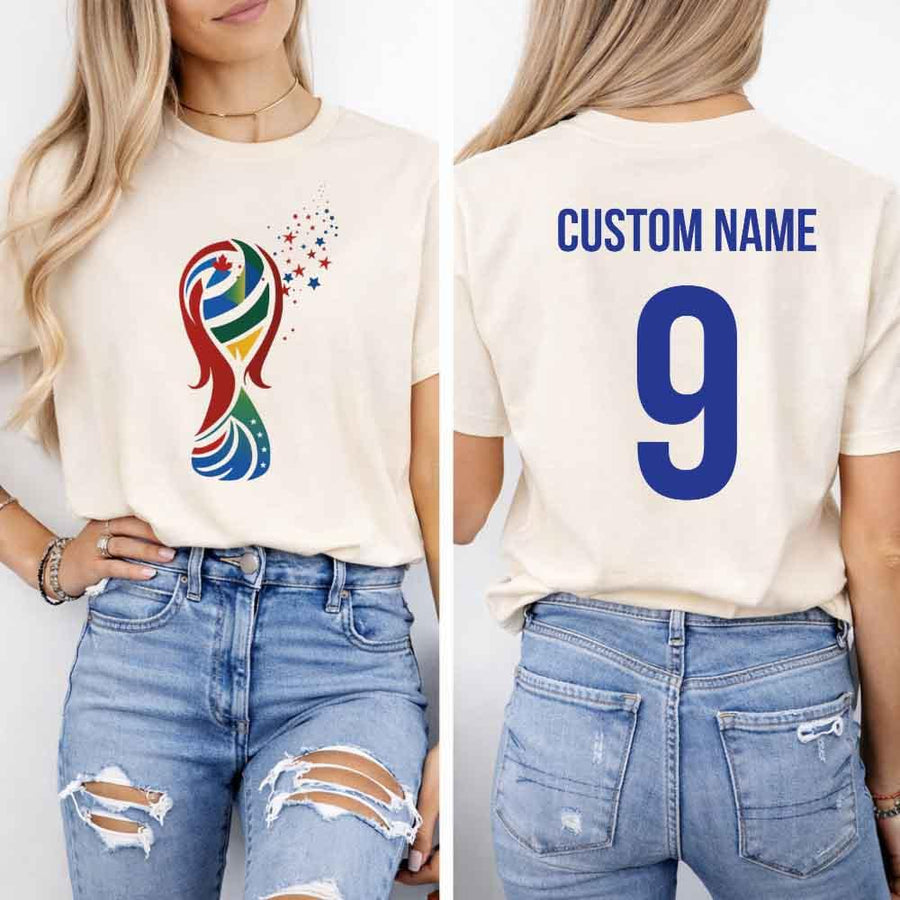 May include a person wearing a cream 2026 World Cup T-shirt featuring bold soccer graphic and relaxed fit.