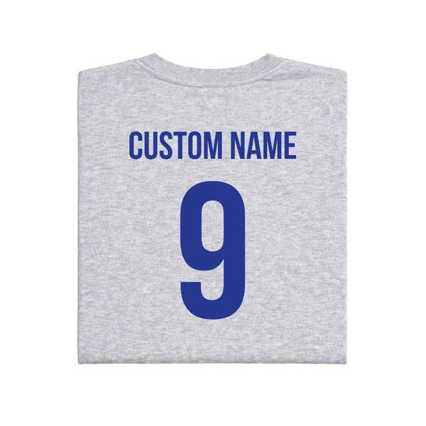 May include a person wearing a gray 2026 World Cup T-shirt featuring bold soccer graphic and relaxed fit.