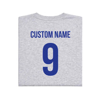 May include a person wearing a gray 2026 World Cup T-shirt featuring bold soccer graphic and relaxed fit.