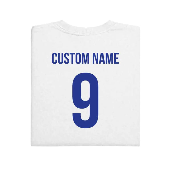 May include a person wearing a white  2026 World Cup T-shirt featuring bold soccer graphic and relaxed fit.