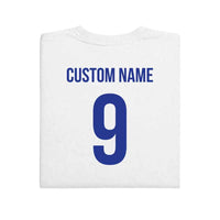 May include a person wearing a white  2026 World Cup T-shirt featuring bold soccer graphic and relaxed fit.