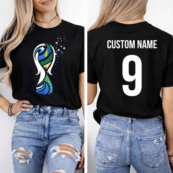 May include a person wearing a black 2026 World Cup T-shirt featuring bold soccer graphic and relaxed fit.