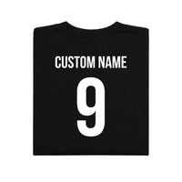 May include a person wearing a black 2026 World Cup T-shirt featuring bold soccer graphic and relaxed fit.