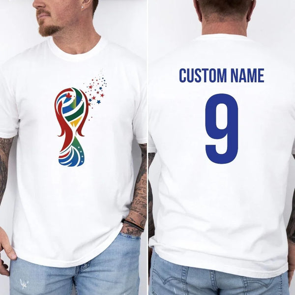 May include a person wearing a white  2026 World Cup T-shirt featuring bold soccer graphic and relaxed fit.