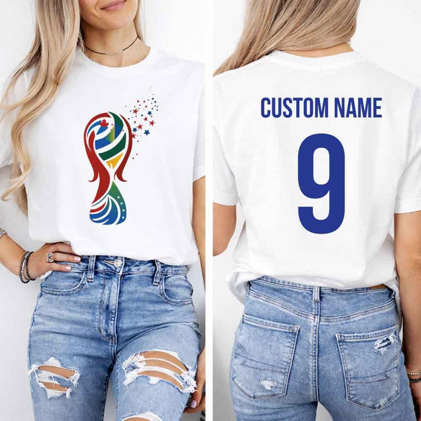 May include a person wearing a white 2026 World Cup T-shirt featuring bold soccer graphic and relaxed fit.