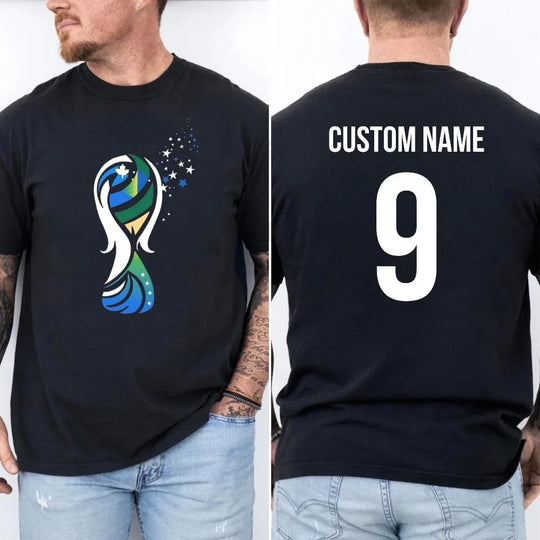 May include a person wearing a black 2026 World Cup T-shirt featuring bold soccer graphic and relaxed fit.