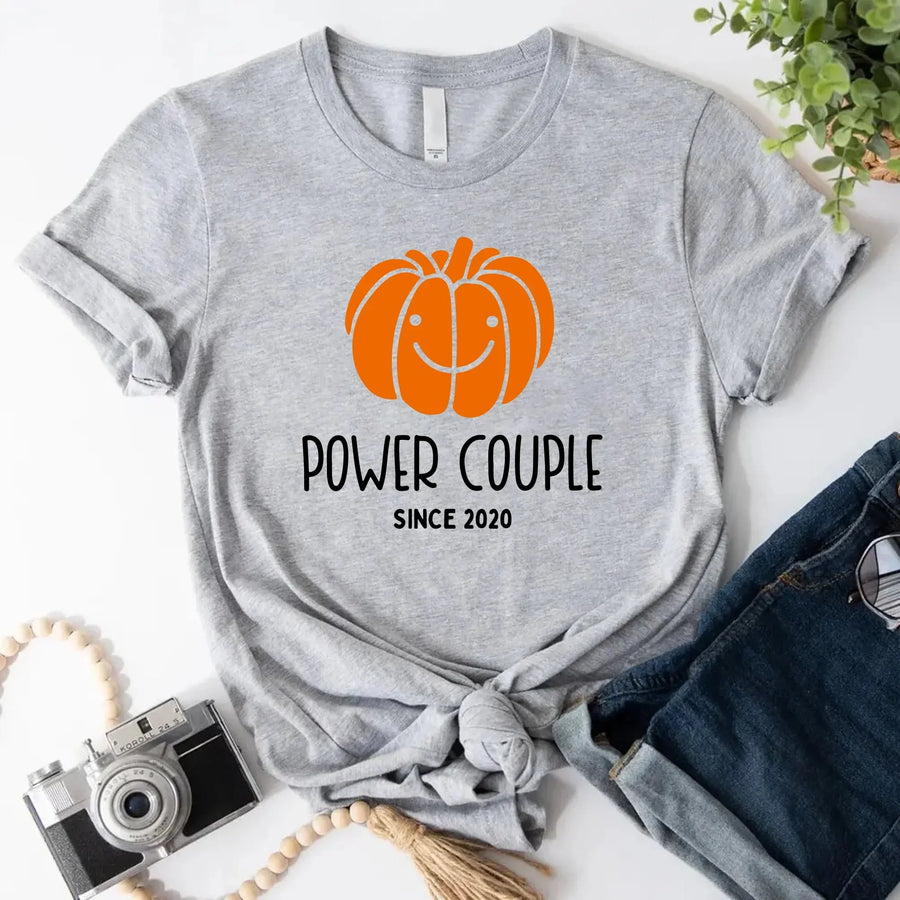 May include a fall-themed couple's design featuring a pumpkin graphic paired with a spice jar, personalized names, and a warm autumn color palette.