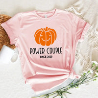 May include a fall-themed couple's design featuring a pumpkin graphic paired with a spice jar, personalized names, and a warm autumn color palette.