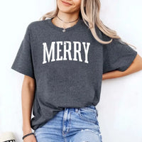 May include an image of the “Merry ” T-shirt featuring a vintage-inspired holiday print on a soft women’s cotton tee with a festive relaxed fit.