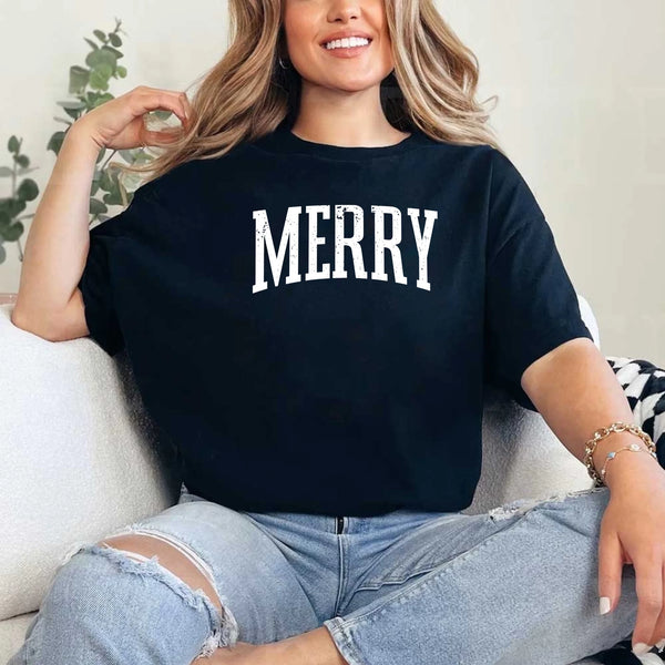 May include an image of the “Merry ” T-shirt featuring a vintage-inspired holiday print on a soft women’s cotton tee with a festive relaxed fit.