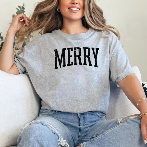 May include an image of the “Merry ” T-shirt featuring a vintage-inspired holiday print on a soft women’s cotton tee with a festive relaxed fit.