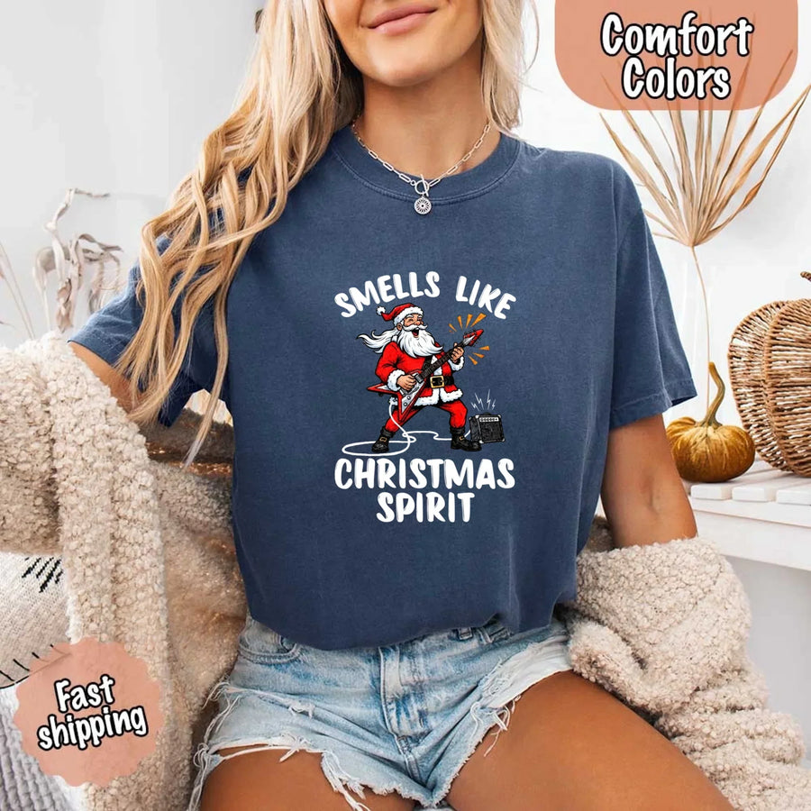 May include a Comfort Colors unisex t-shirt featuring a vintage-style Santa Claus graphic and the text “Smells Like Christmas Spirit” printed on soft cotton fabric.