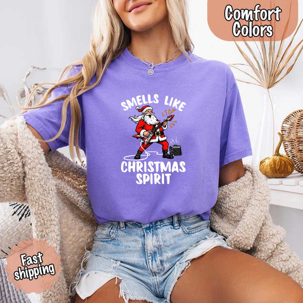 May include a Comfort Colors unisex t-shirt featuring a vintage-style Santa Claus graphic and the text “Smells Like Christmas Spirit” printed on soft cotton fabric.