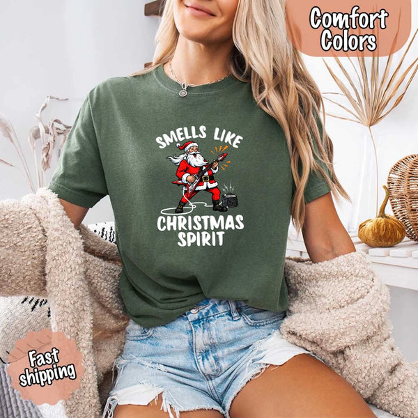 May include a Comfort Colors unisex t-shirt featuring a vintage-style Santa Claus graphic and the text “Smells Like Christmas Spirit” printed on soft cotton fabric.