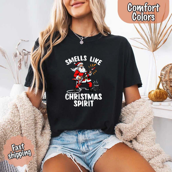 May include a Comfort Colors unisex t-shirt featuring a vintage-style Santa Claus graphic and the text “Smells Like Christmas Spirit” printed on soft cotton fabric.