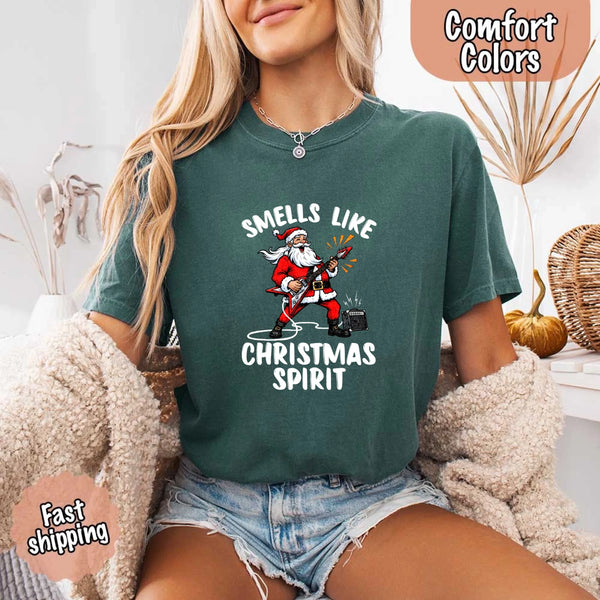 May include a Comfort Colors unisex t-shirt featuring a vintage-style Santa Claus graphic and the text “Smells Like Christmas Spirit” printed on soft cotton fabric.