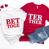 Two t-shirts with text and denim shorts on a white background