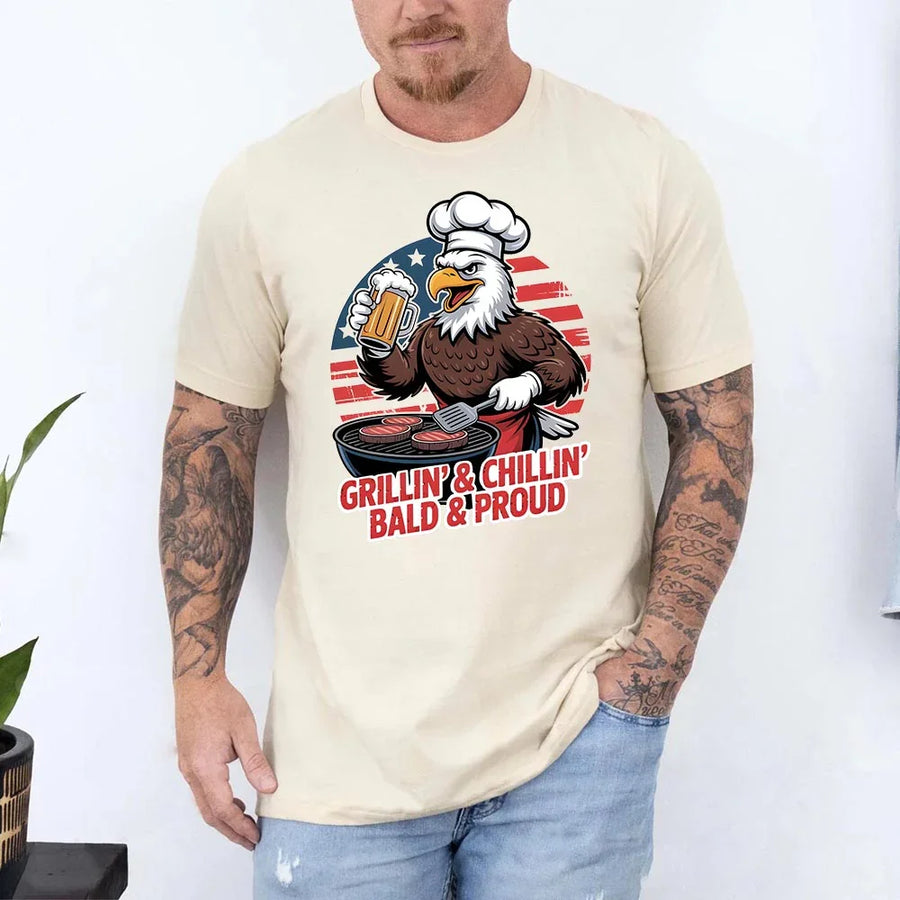 Man wearing a t-shirt with an eagle graphic and text, standing against a white background.