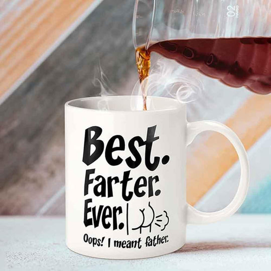 Mug being filled with steaming coffee, featuring the text 'Best Farter Ever. Oops! I meant father.'