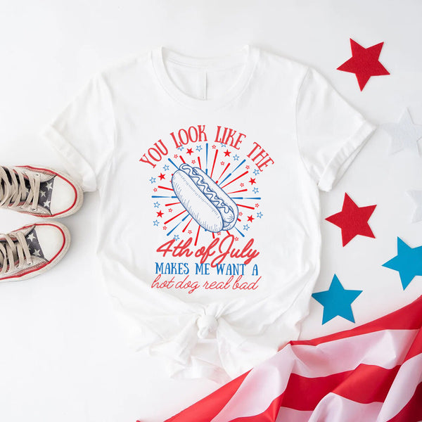 White t-shirt with 4th of July design, red and blue stars, and American flag on a white background.