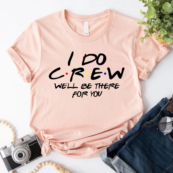 Peach T-shirt reading “I do crew, we’ll be there for you,”