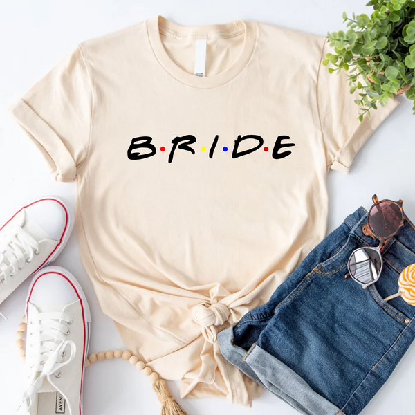 Beige T-shirt reading “Bride,”