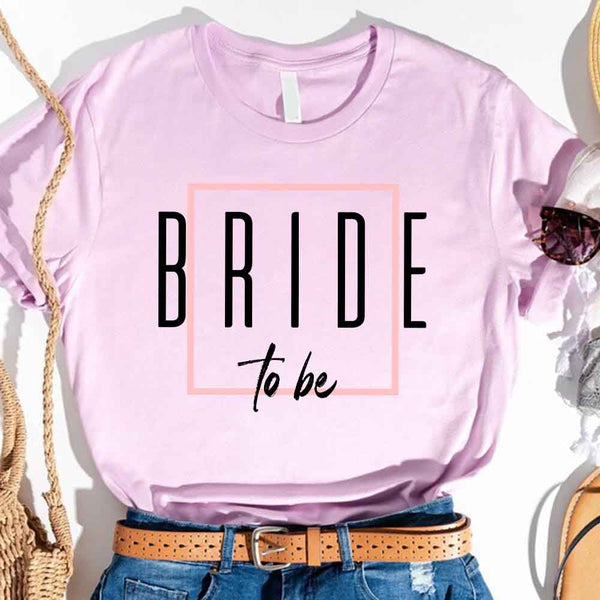 Lavender t-shirt with 'BRIDE to be' text, worn with denim jeans and a brown belt.