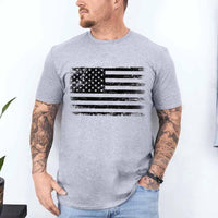 Man wearing a gray t-shirt with an American flag design on a white background