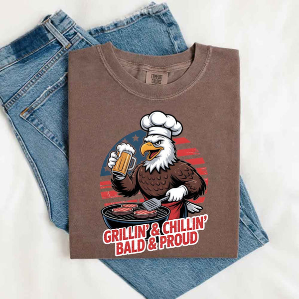 Folded brown t-shirt with an eagle graphic and text on a white background