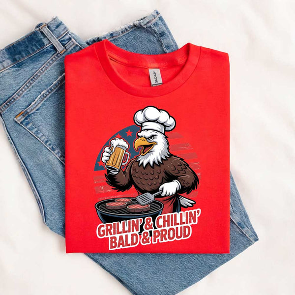 Red t-shirt with an eagle graphic and text 'Grillin' & Chillin' Bald & Proud' on a white background.
