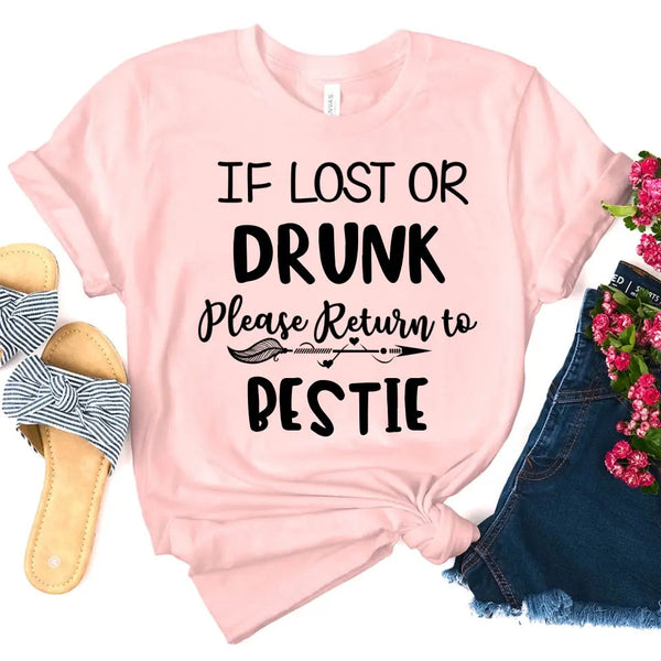 Pink t-shirt with humorous text design, sandals, denim shorts, and flowers on a white background