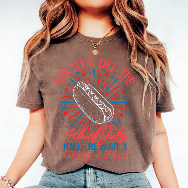 Person wearing a brown t-shirt with a hot dog graphic and text on a white background