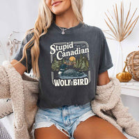 May include a person wearing a Pepper Stupid Canadian Wolf-Bird Comfort Colors T-Shirt featuring sports romance inspired graphic and relaxed fit.