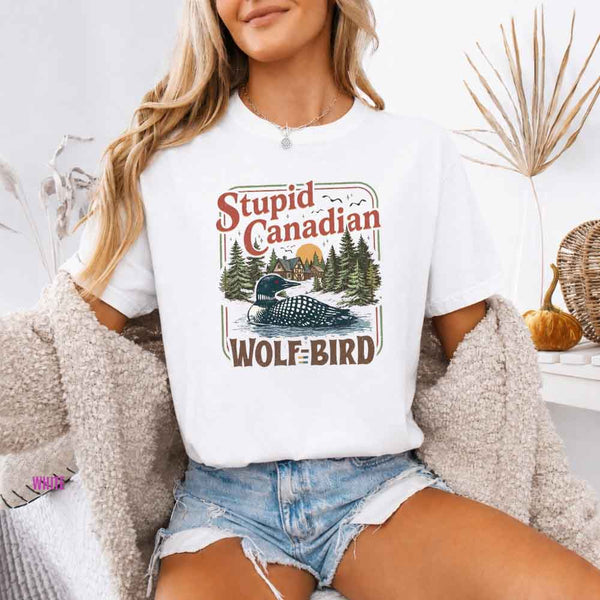 May include a person wearing a White Stupid Canadian Wolf-Bird Comfort Colors T-Shirt featuring sports romance inspired graphic and relaxed fit.