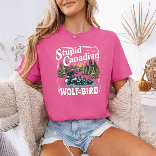 May include a person wearing a Crunchberry Stupid Canadian Wolf-Bird Comfort Colors T-Shirt featuring sports romance inspired graphic and relaxed fit.