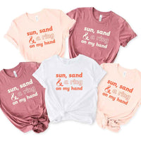 May include beach themed wedding party t-shirts with Sun Sand and A Ring On My Hand slogan, tropical colors, bridal group apparel for summer celebrations!